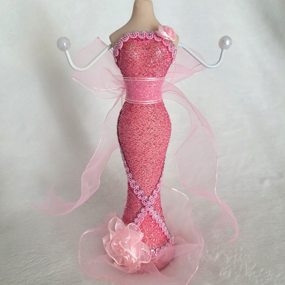 Jewelry standholder porcelain manican with detailed pink dress. Two arm prongs.